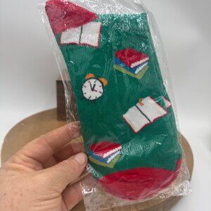 repeating pattern of books and alarm clocks, likely designed for teachers or bac